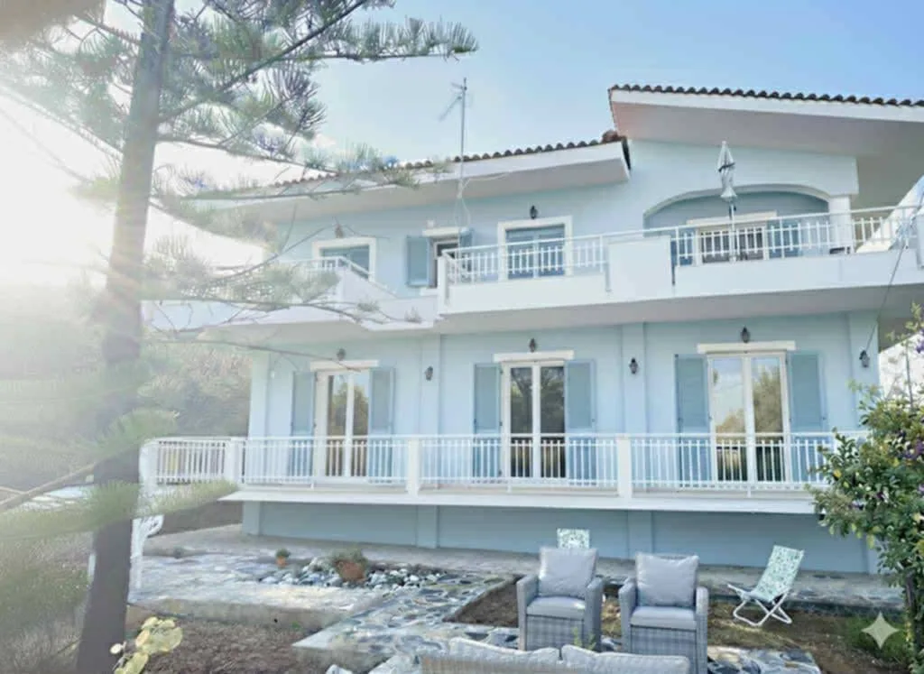 villa exterior at sunset before AI photo enhancement