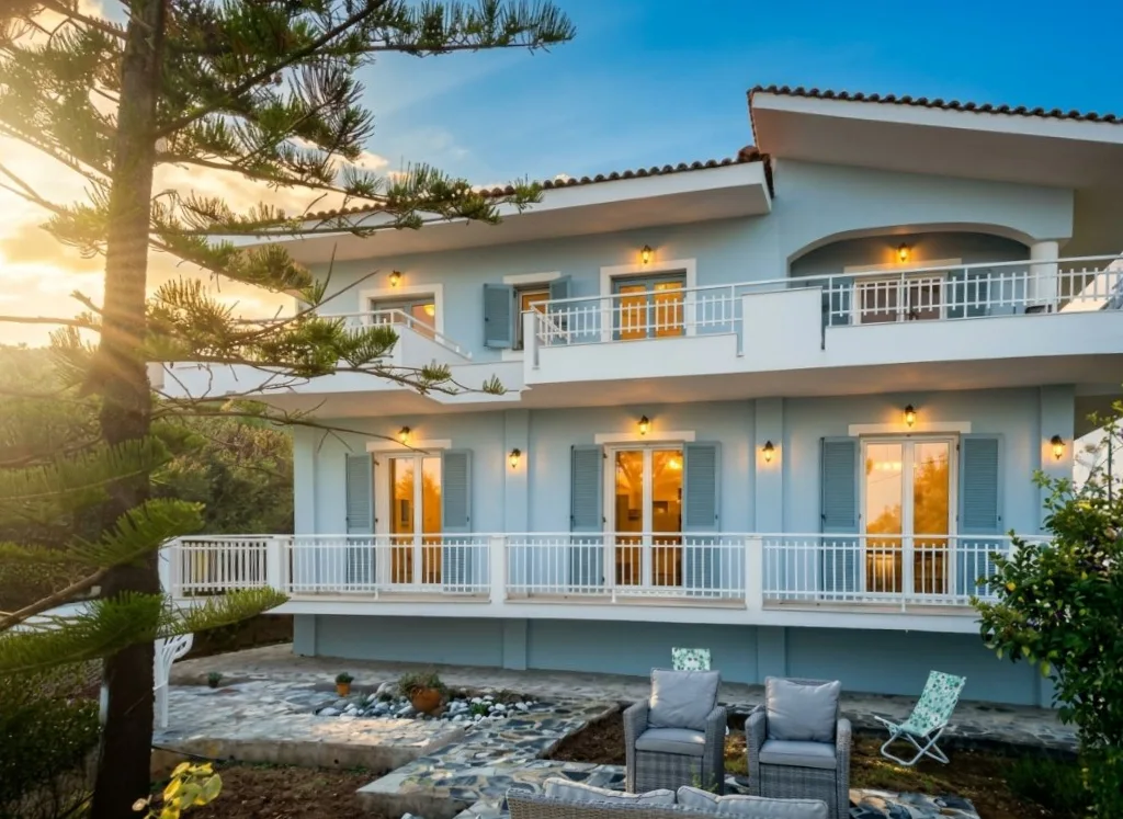 villa exterior at sunset after AI photo enhancement — LuxLens AI