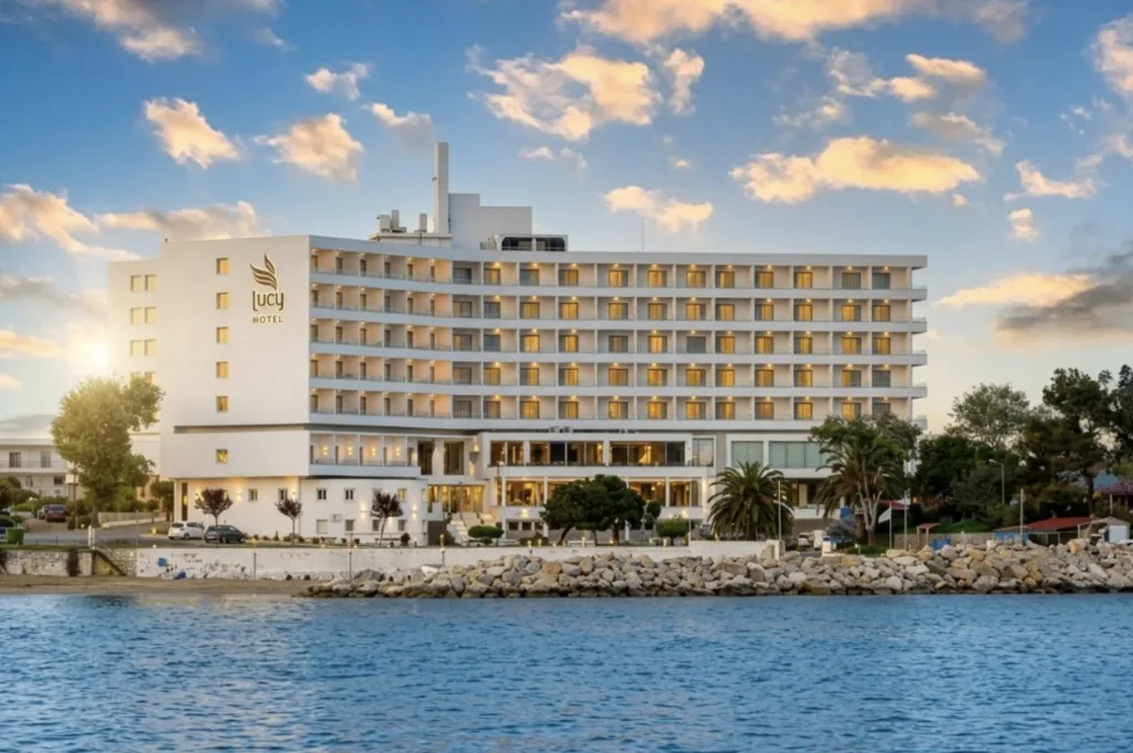 seafront hotel at sunset after AI photo enhancement — LuxLens AI