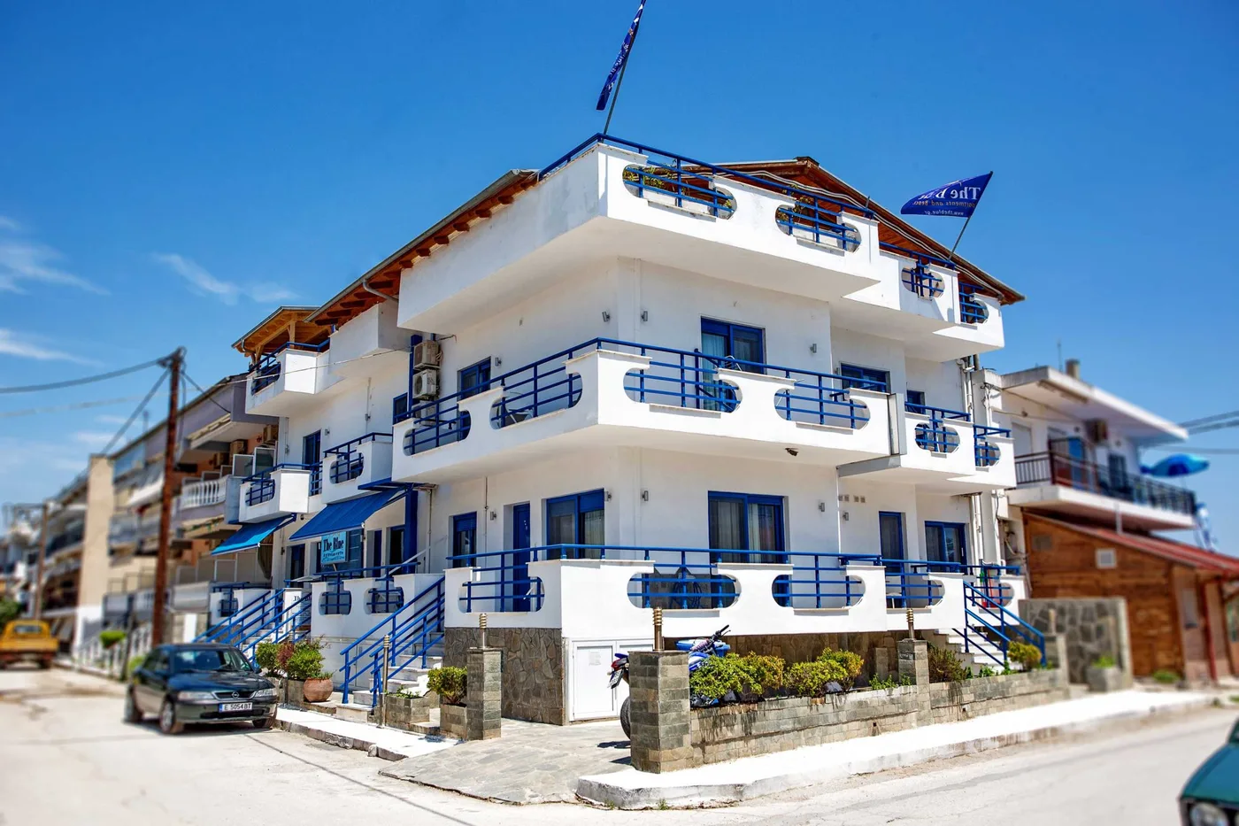 The same seaside apartment building before retouching